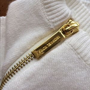 Michael Kors cream sweater with gold zipper detail