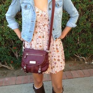Cross over body burgundy purse.