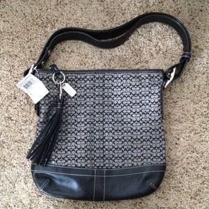 Coach mini signature duffle purse.