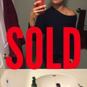 Black off-the-shoulder sweater