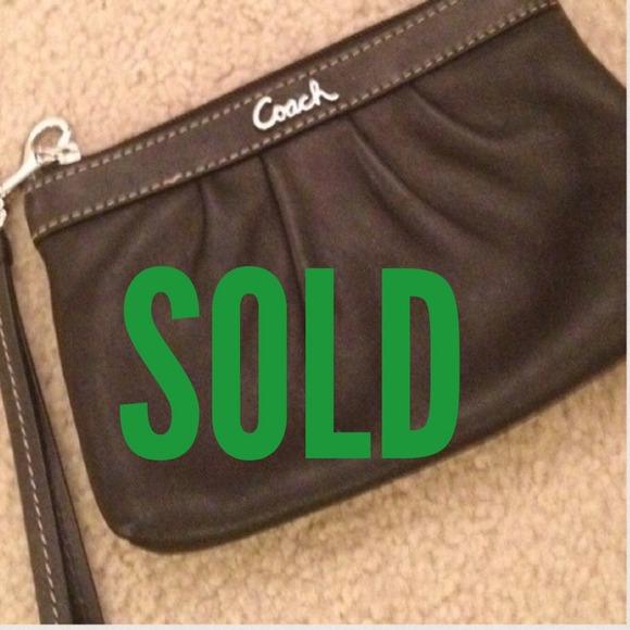 Coach leather black wristlet.