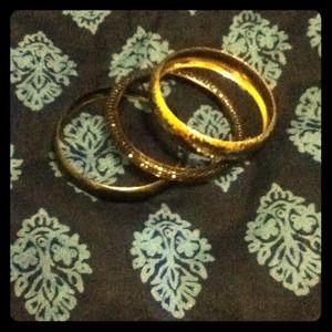 Set of three bangles. Gold, charcoal, and textured