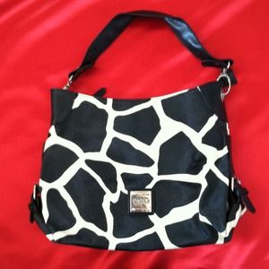 Cowhide pattern purse pleather material.