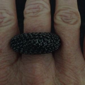 Solid hematite color ring. New in box