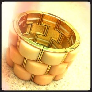 Peach/light pink colored bracelet