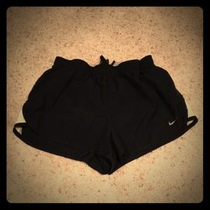 Black Nike shorts w/ neon yellow stripe