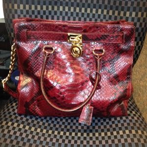 Michael Kors red python bag and matching wallet.