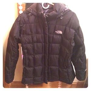 Down jacket by North Face black size M mid length