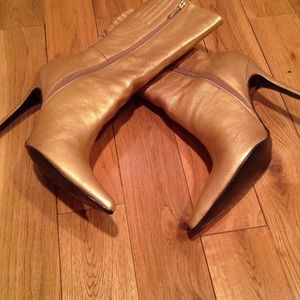 Liquid gold mid calf boots.
