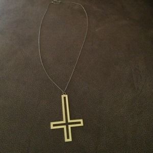 Gold cross necklace.