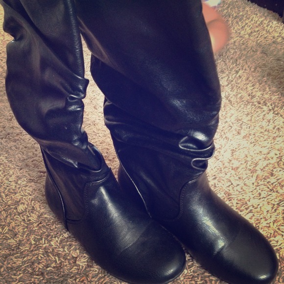 Mid calf black flat boots..