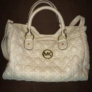 Cream color  purse with golden accents