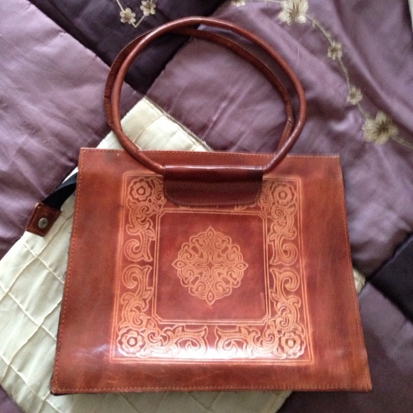 Cute embossed leather bag.