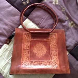 Cute embossed leather bag.