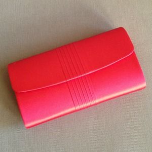 Red satin material clutch