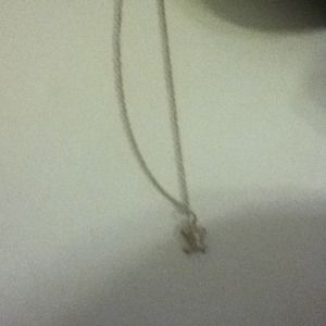 A cute scull necklace with pink jewls