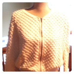 Whit zip front sweater.