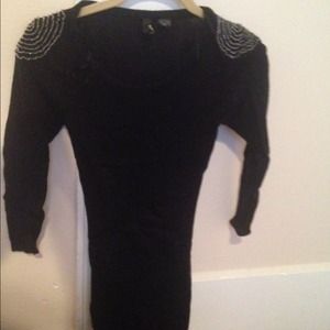 Black dress with shoulder pad detail