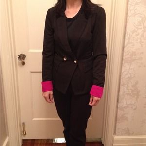 Brand new black blazer with bright pink cuffs. Brand new black blazer with bright pink cuffs.