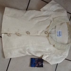 Beige top or blazer.