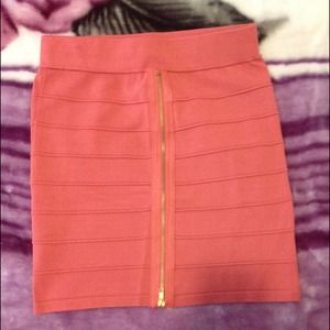 Coral bandage skirt with front gold zipper
