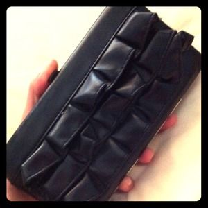 Black ruffled wallet-clutch.