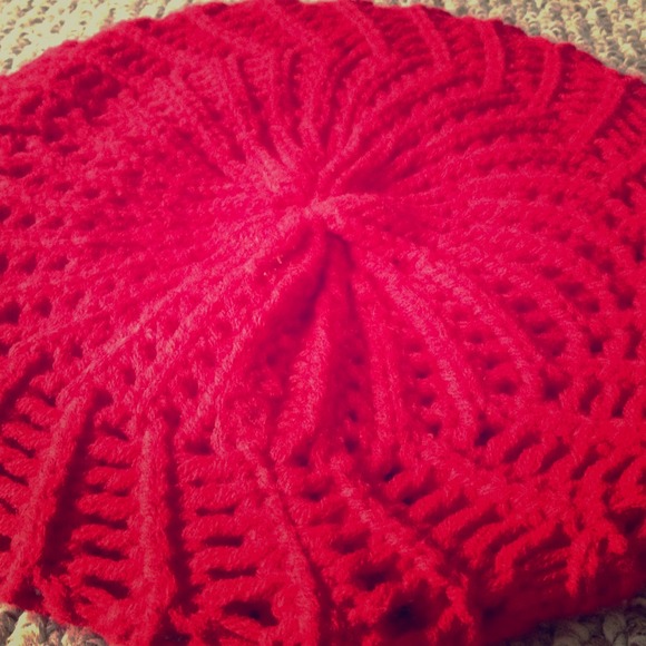 Winter red knitted beret.