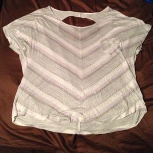 White shirt with gray and purple chevron stripes.