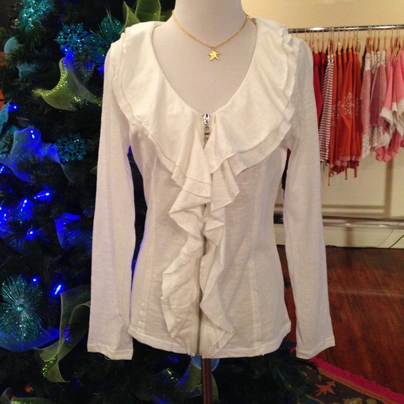 White, ruffled top.