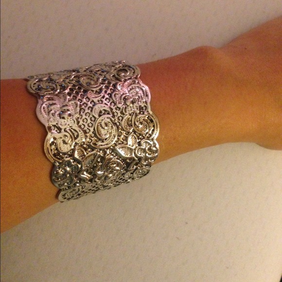 Silver tone cuff bracelet.