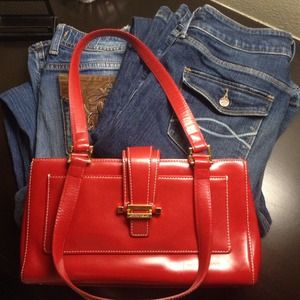 Red leather Antonio Melani purse with gold accents