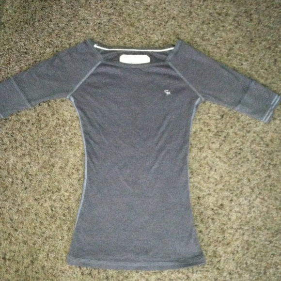 Brownish/ grayish half long sleeved shirt.
