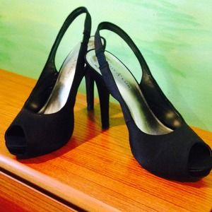 Black satin slingback pumps