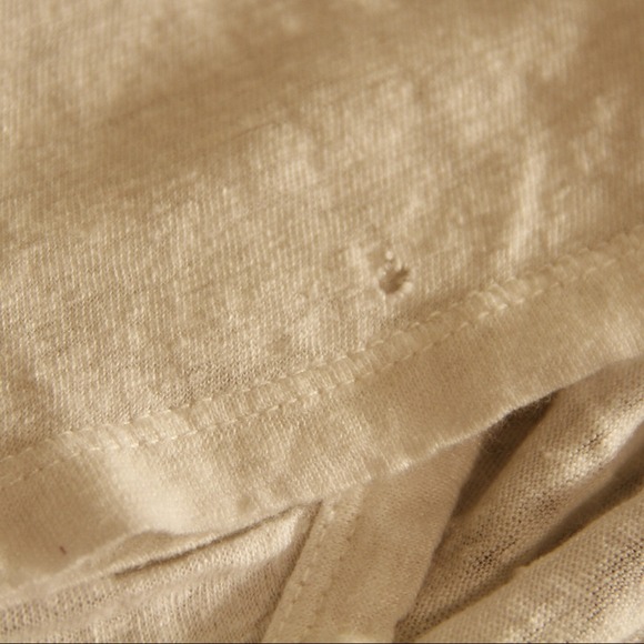 Photos of tiny hole on Joie shirt.