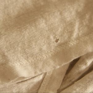 Photos of tiny hole on Joie shirt.