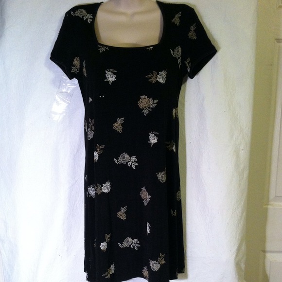Black dress with white flowers .
