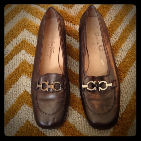 Coppery colored Ferragamo flats with emblem