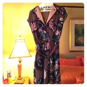 A short sleeve, belted dress, with a v-neck