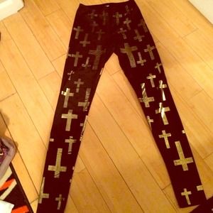 Stretch skinny pants w/ gold crosses.
