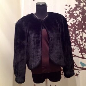Luxurious faux fur coat with padded shoulders