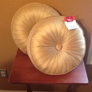 Two brand-new goldish color throw pillows
