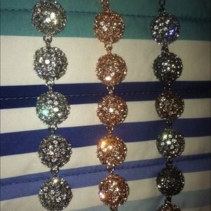 3 different color bracelets gold, silver, purple