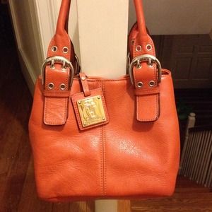 Tignanello orange purse with matching key chain.