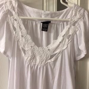 Very pretty white top with flowers on the top!