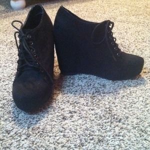 Black heeled low top boots
