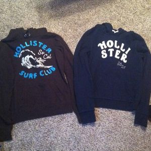 A brown and dark blue hollister sweatshirts