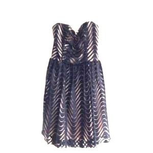 Strapless black lace dress with beige underlining