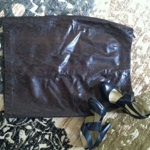 Brown and black 100 percent leather skirt.