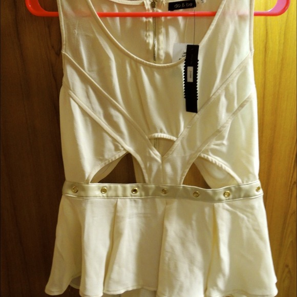 Cream peplum tops with cut outs