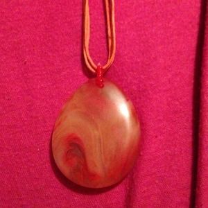 Red swirl rock necklace